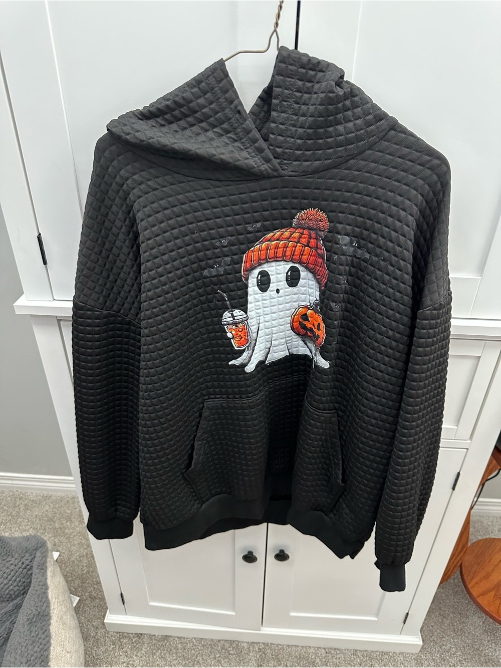 Halloween is coming! Woman’s Black Hoodie with Ghost Graphic and Orange Beanie.